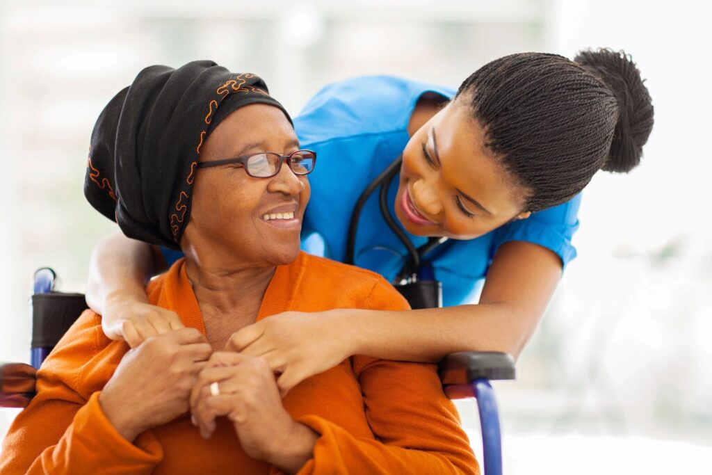 caregiver hugging elderly woman